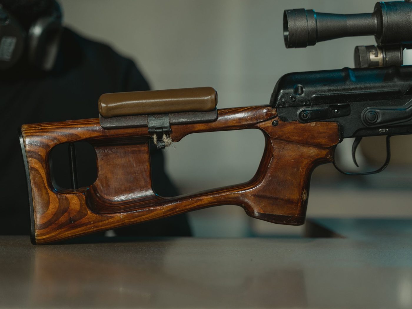 A rifle stock at the bench during fitment work